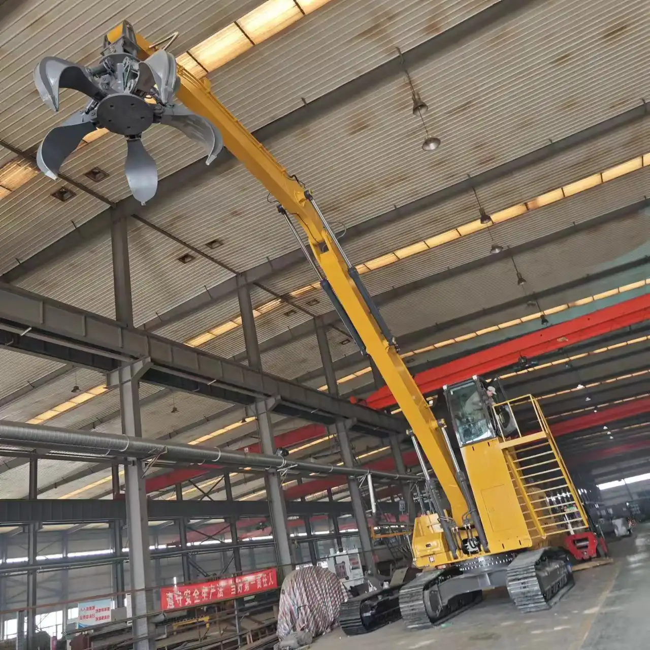 What are the advantages of a hydraulic grab arm in demolition work?